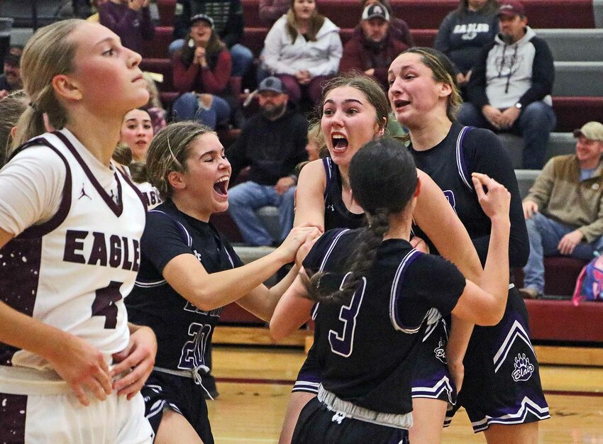 Blair freshman Gueryn Kay, middle, celebrates her game-winning 3-pointer with Kaitlynn O'Neil, from left, Laynie Brown (3) and Addie Sullivan on Monday as the Eagles' Macy Wolf, far left, walks to the bench at Arlington High School.