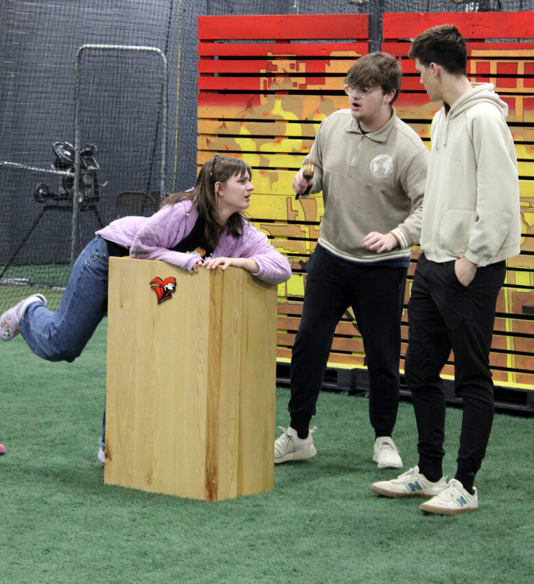 Fort Calhoun High School one-act actors rehearse &quot;The Day the Internet Died&quot; Thursday evening at the Community Building. Pictured from left, Natalie Lammers, who plays Agnes; Eric Ertzner, who plays the mayor; and Harrison Geiger, who plays the sheriff.