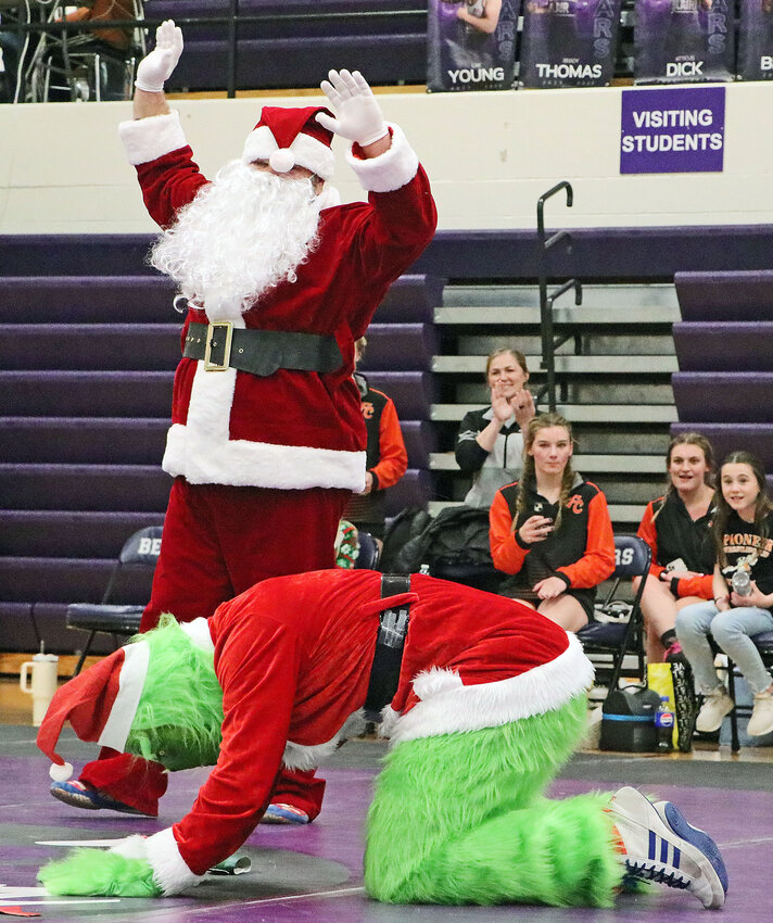 Santa Claus wrestled the Grinch on Dec. 18 during the Two River Ruckus girls wrestling quadrangular at Blair High School.