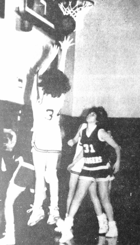 Cindy LeCrone (34), pictured shooting a close shot against Bennington, and the Arlington Eagles earned their first win of the 1989-1990 season in January against North Bend.