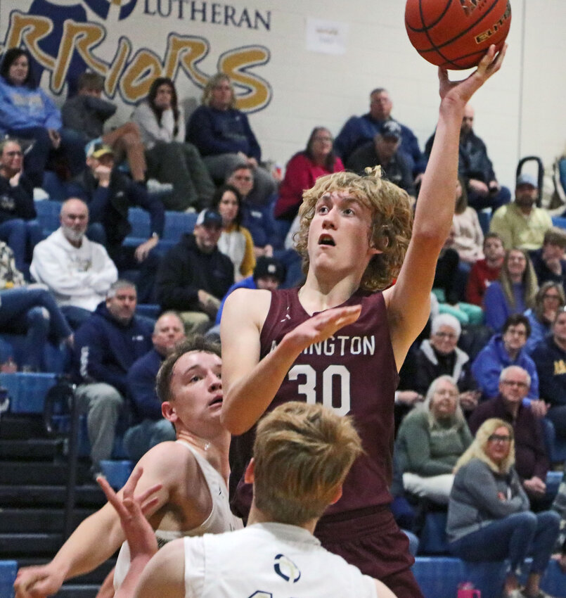 Arlington's Trent Koger shoots in the paint Dec. 29 at Lincoln Lutheran.