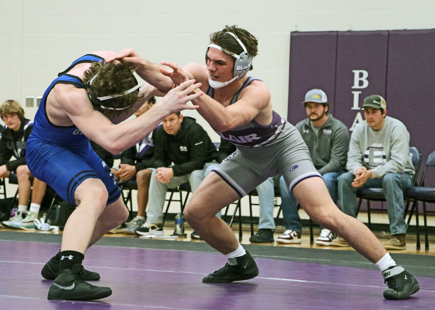 Bears wrestler Brock Templar, right, competes against Underwood's Maddox Nelson on Tuesday during a triangular at Blair High School.