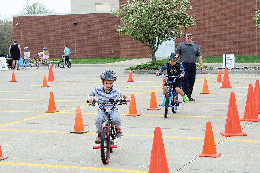 As part of the Blair Optimist Club's bike rodeo, held one May 2023 morning at Otte Blair Middle School, kids could ride around an obstacle course with the help of Blair Police officers.