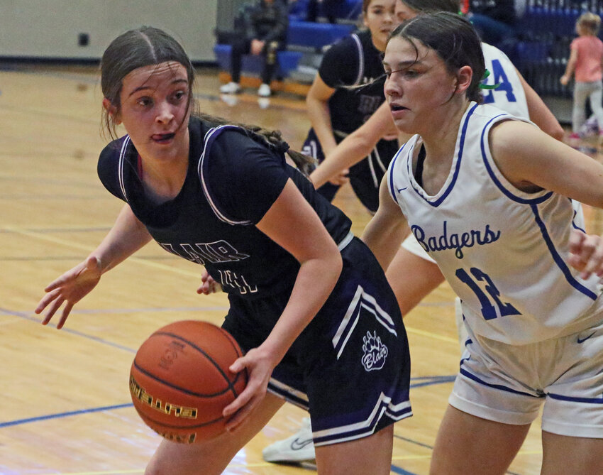 Blair sophomore Kate Wulf, left, keeps the ball from Harper Bohaboj and the Badgers on Saturday at Bennington High School.