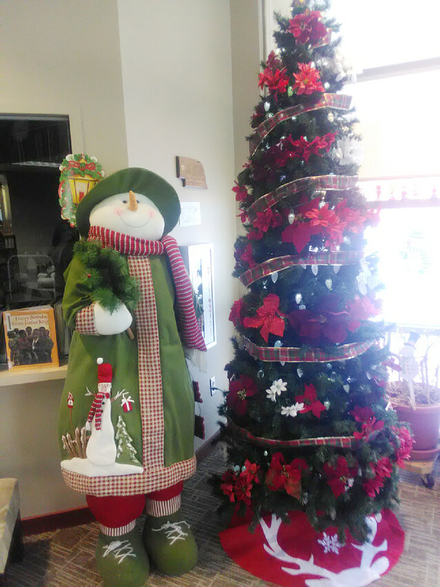 The Lyons Public Library was pleased to add a six foot tall snowman donated by Petal Pushers.