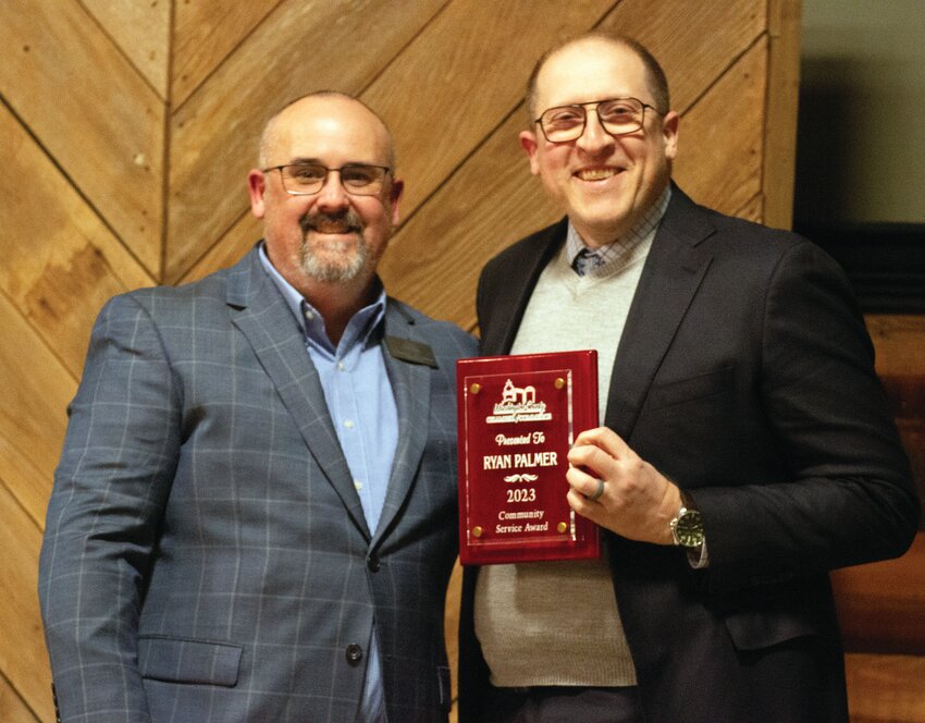 Ryan Palmer, right, was awarded the 2023 Community Service Award at the Washington County Chamber of Commerce annual meeting Thursday at the Rybin Building at the Washington County Fairgrounds. Pictured with Palmer is Chamber Director Brad Earley.