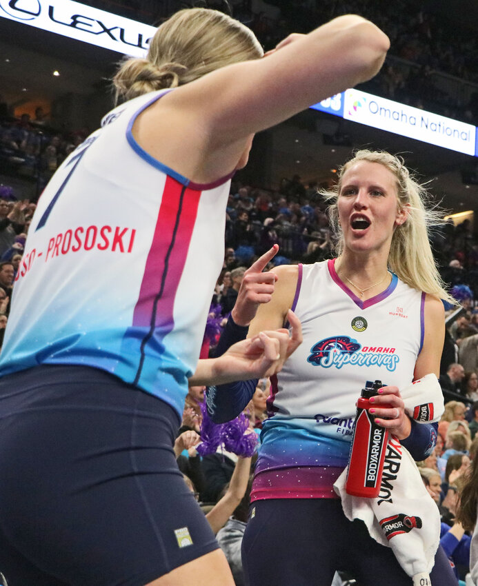 Omaha Supernovas outside hitter Jess Lansman, right, celebrates a point with former Nebraska Cornhusker Gina Mancuso-Prososki on Jan. 24 at the CHI Health Center. Lansman joined the Blair volleyball coaching staff in 2022 and was named the head coach last November.