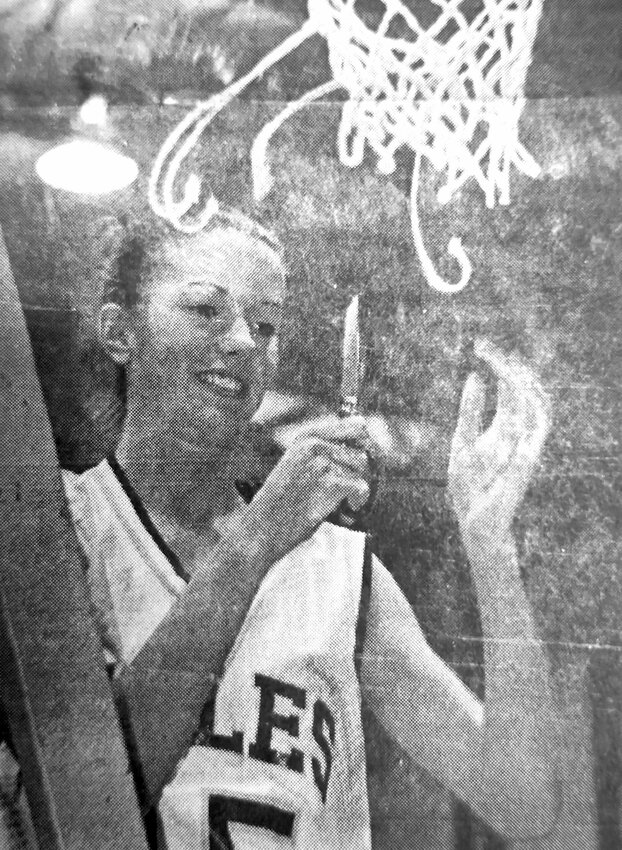 The Arlington Eagles cut down the nets after winning their 2001 conference tournament. This Eagle went unidentified on the front page of the Citizen newspaper.