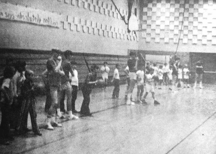 Arlington High School basketball players help coach fourth- and fifth-graders in 1972.