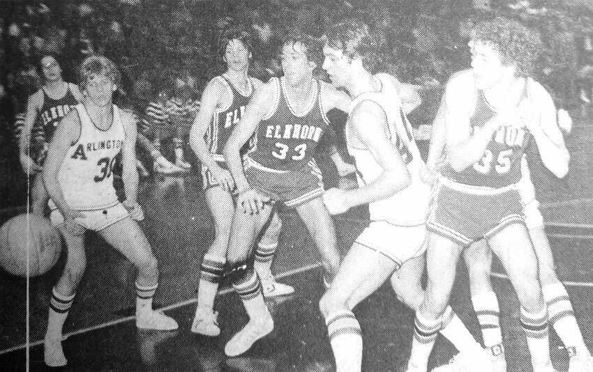 Arlington's Phill Kollars, left in white, and Dwight Wrich, middle right in white, contend for a loose ball with Elkhorn in 1980.