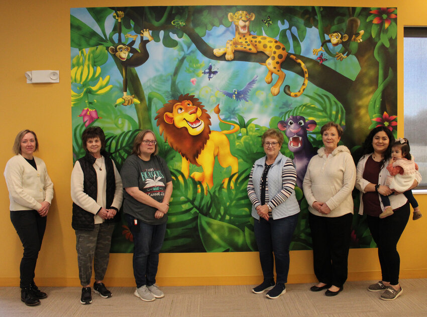 The Blair Friends of the Library purchased a seven column mural for the children's section of the Blair Public Library and Technology Center. Pictured from left: Brooke Zarco, Alice Dale, Wendy Lukert, Joleene Rewerts, Peggy Leehy, Yoana Orozco and Danae Orozco.