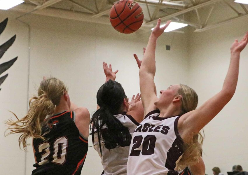 Fort Calhoun's Maelie Nelson, from left, and the Eagles' Taylor Arp and Austyn Flesner contend for a rebound during the Washington County team's Jan. 30 game at Arlington High School. The schools met again Thursday for a subdistrict title.