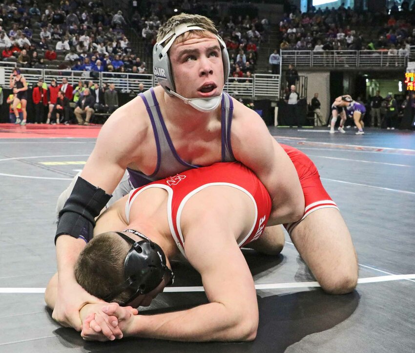 Blair 175-pounder Blaise Baughman, top, takes a look at the clock during a medal-round match Saturday in Omaha.