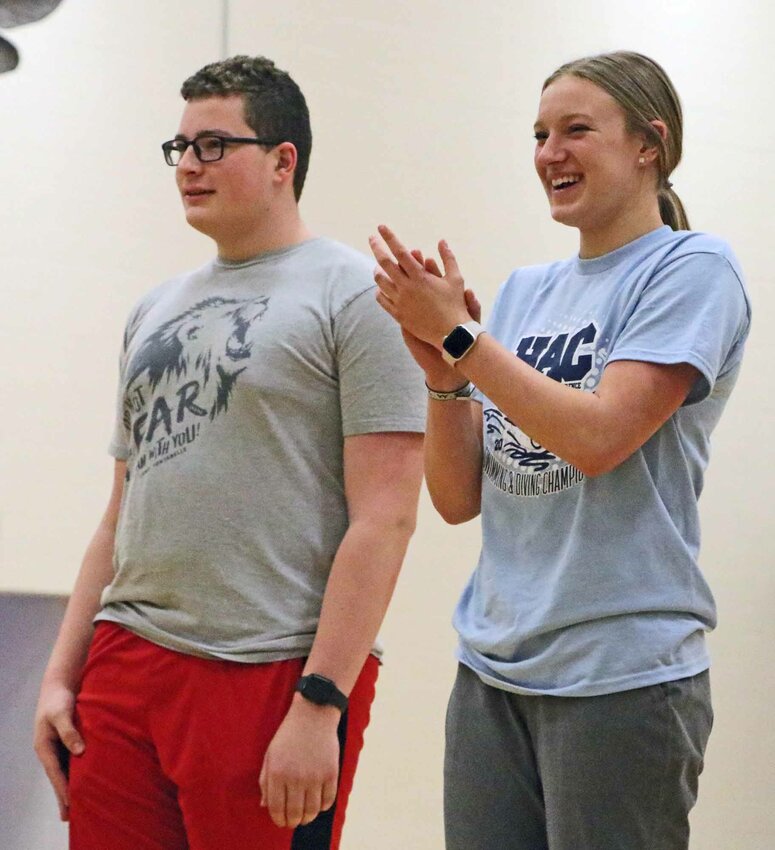Swimmers Dathan Hansen, left, and Lizzie Meyer enjoy themselves Feb. 14 during an Arlington High School pep rally celebrating state-qualifying swimmers, wrestlers and dance team athletes.
