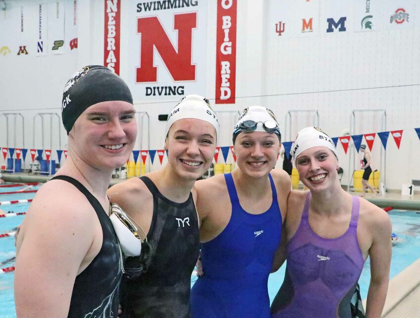 Fremont Tigers Madelyn Buck, from left, Jane Busboom, Lizzie Meyer and Ryleigh Schroeter pose for a photo Friday after setting a new 400-yard freestyle relay school record during the NSAA State Swimming &amp; Diving Championships in Lincoln. Buck attends FHS, while Busboom and Schroeter are Blair student-athletes, and Lizzie Meyer is a multi-sport athlete at Arlington.