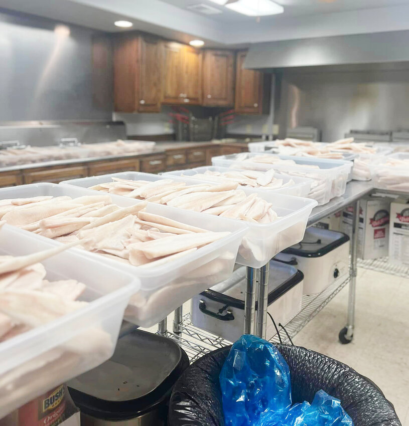 It is a long process to thaw out over 400 pounds of fish for the Lyons Fire and Rescue Department's fish fry. It takes almost every inch of counter space to do so.
