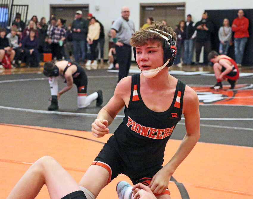 Junior high Pioneer Nolan Larrick stands up after pinning his opponent Friday at Fort Calhoun High School. The Pioneers hosted Otte Blair Middle School, Arlington and others for their annual tourney. Both high school gyms were utilized for the boys and girls event with four mats active.