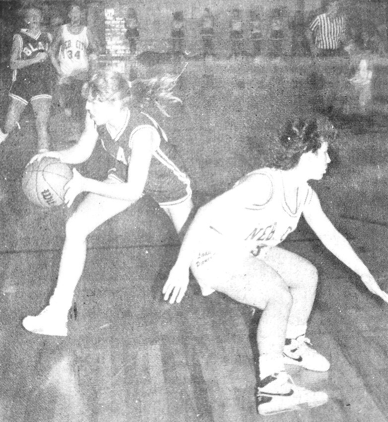 Jodi Kruse of Blair, left, leaves a Nebraska City defender flat-footed during a game in 1989.
