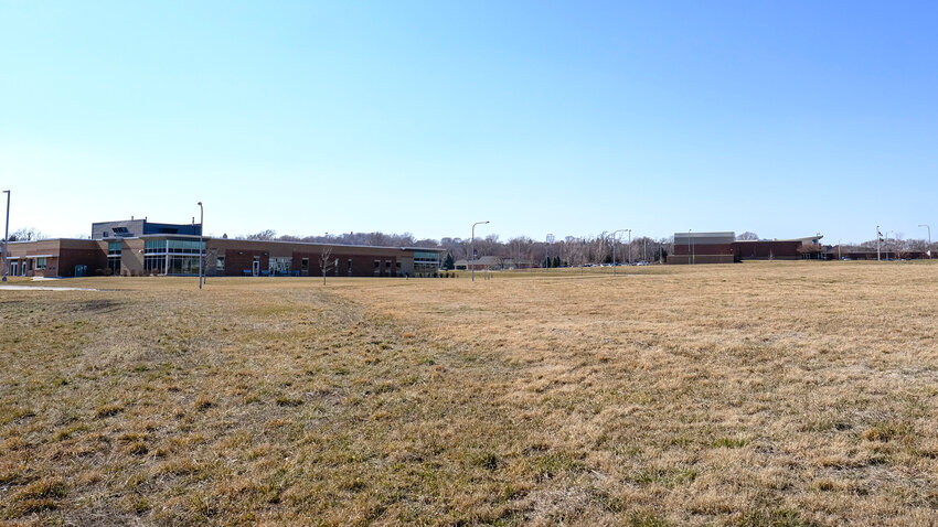 The Generations Park site near Deerfield trail facing northwest with the Blair Public Library and Technology Center in the background.