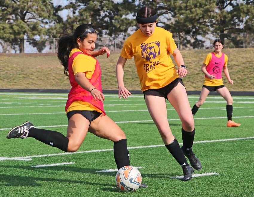 Blair soccer players Valeria Hernandez, from left, Katie Kramer and Laynie Brown practice Thursday morning at Krantz Field. Hernandez and Kramer are two of the Bears' four seniors.