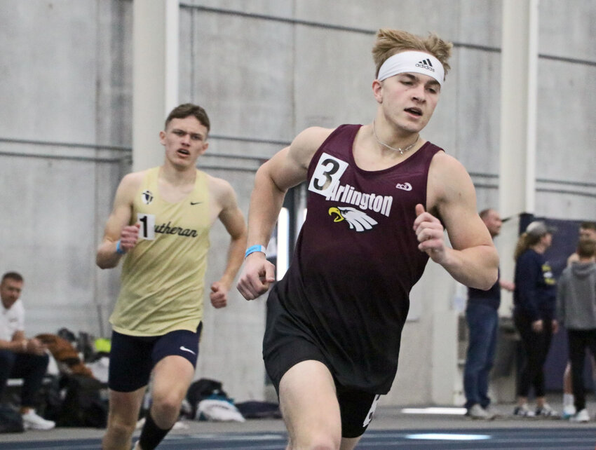 Arlington senior Kevin Flesner, right, leads the 800-meter run Friday at Concordia University in Seward. The Eagle set a meet record in the event as his team won the Bulldog Challenge's Forest Division.