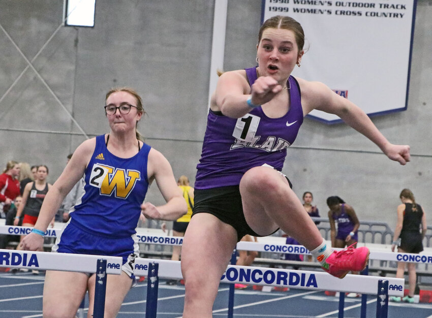 Blair's Haylie Jensen, right, competes in the 60-meter hurdles Thursday during the Bulldog Challenge at Concordia University in Seward. Jensen's BHS girls team won the Sandhills Division to open the spring track season.