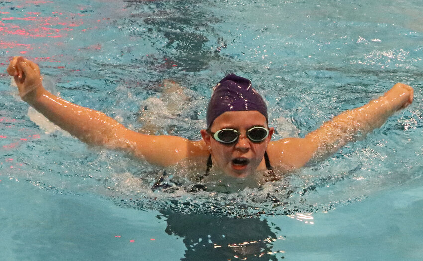 The Blair Family YMCA Swim Team's Brooklyn Ballinger, 9, competes during the 200-yard medley relay in Fremont. She and her fellow Barracudas participated in the Nebraska YMCA State Championships there on Saturday.