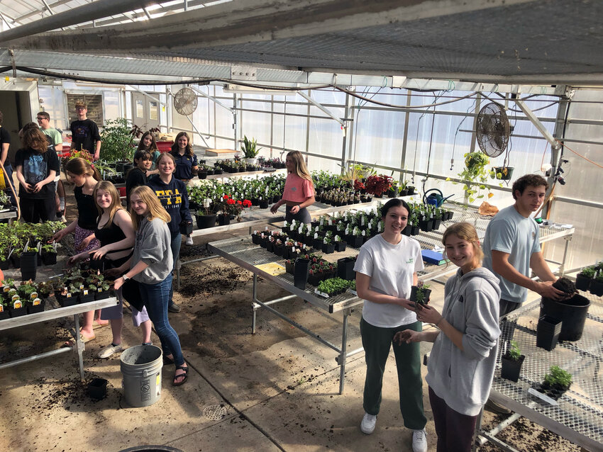 The Blair High School ag education students work in the greenhouse with National FFA President Amara Jackson last Tuesday.