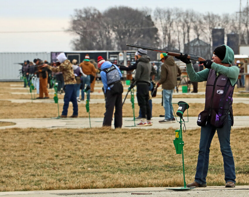 Blair Youth Shooting Sports' Emily Loerzel, right, competes Saturday during an Eastern Cornhusker Trapshooting Conference north of Blair.