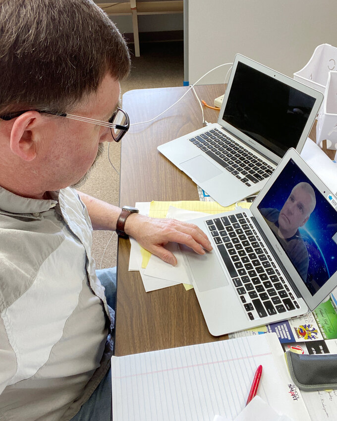 Pastor Jeff Clark of New Life Assembly in Lyons takes part in a district conference call. Was one of the many things he has learned to do over the last 20 years.