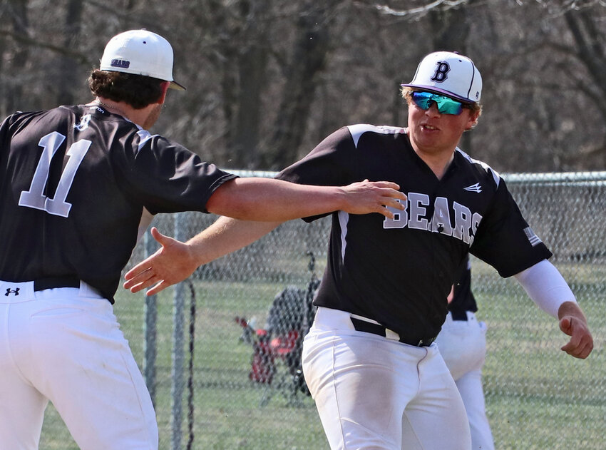 Blair seniors Brady Brown, left, and Dylan Swanson celebrate Friday's win at Hickman City Park.