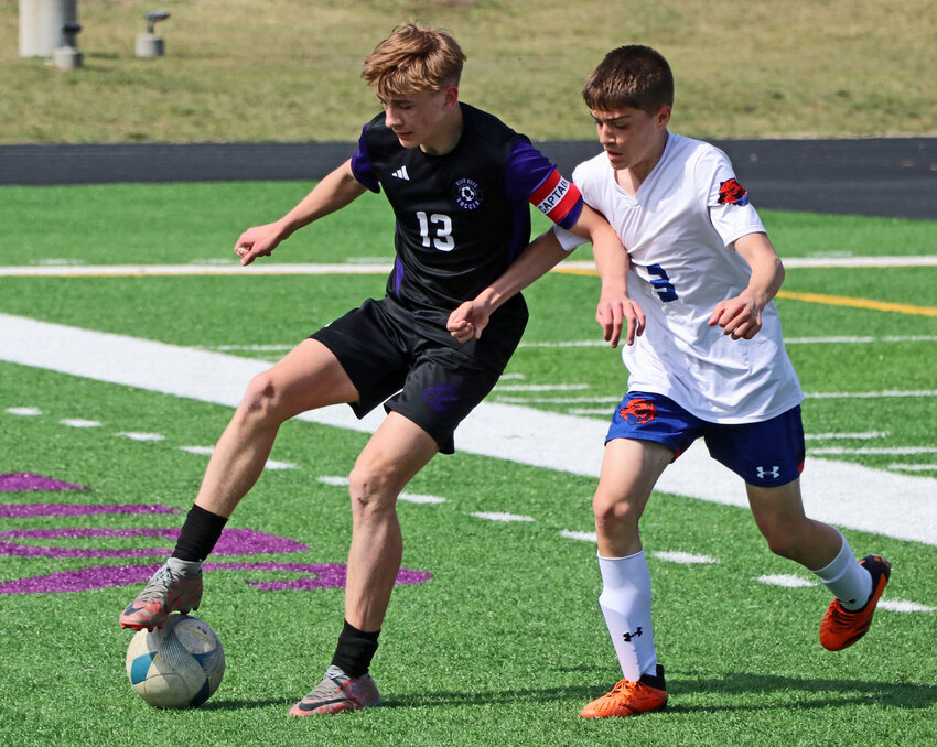 Blair sophomore Eli Belsky, left, keeps the ball from Omaha Westview's Ryan Sturgeon on Saturday at Krantz Field. The Bears topped the Wolverines for their third win of the season.