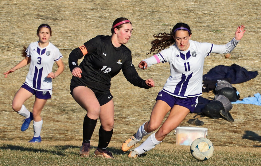 Blair junior Brynn Ray, right, chases down the ball as the Mustangs' Phoebe Barb, middle, and Kaitlynn O'Neil contend for it, too, March 27 at Omaha Concordia.