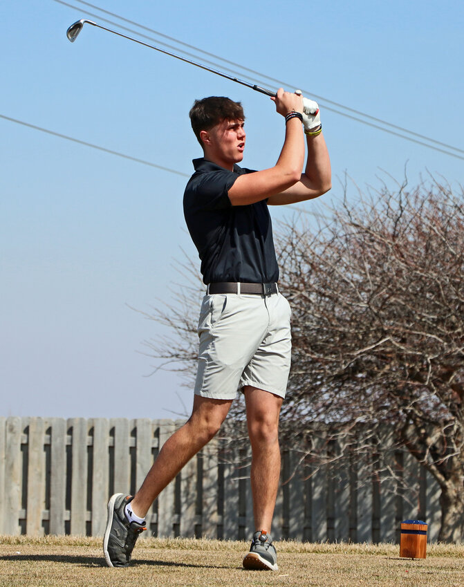 Arlington senior Josh Hamre tees off Thursday at Stone Creek Golf Course. The Eagles faced Omaha Concordia in their season-opening competition.