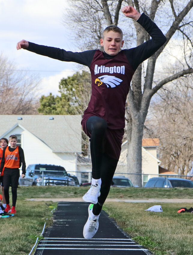 The Eagles' Landon Shada competes in the long jump Tuesday at Arlington High School.