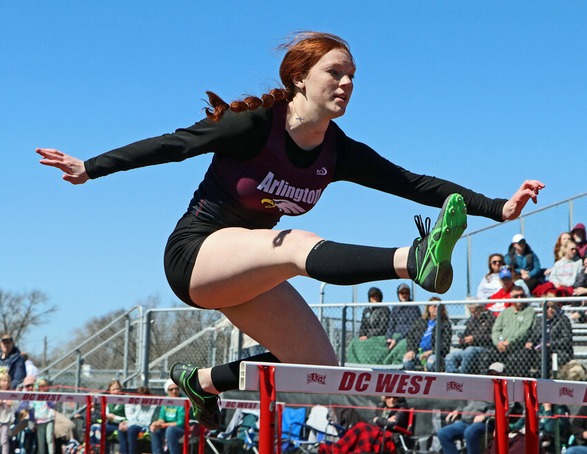 Arlington's Callee Shearer clears a hurdle Thursday during the Douglas County West Invitational in Valley.