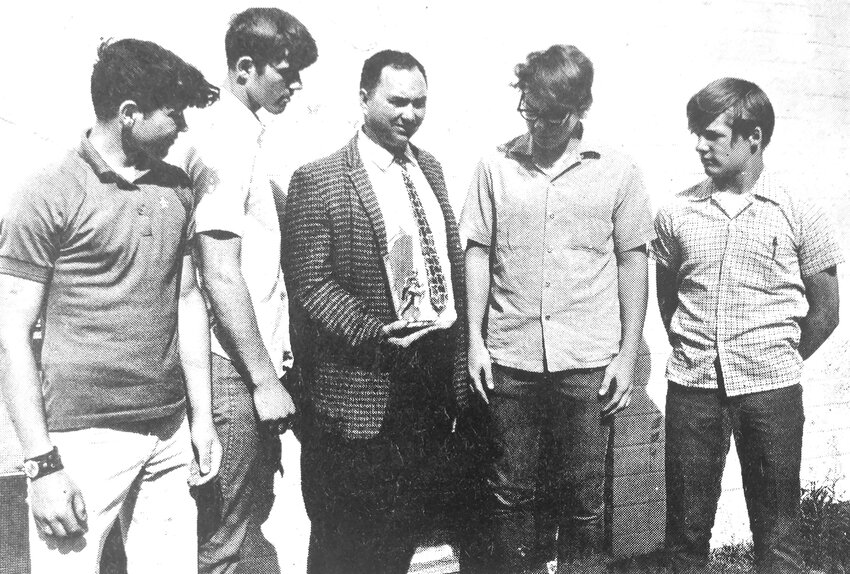 Dennis Caron, from left, Dave Caron, coach Ernest Ridgeway, Dave Romans and Bruce Sill of the Fort Calhoun track and field team combined to win a conference race in 1970.