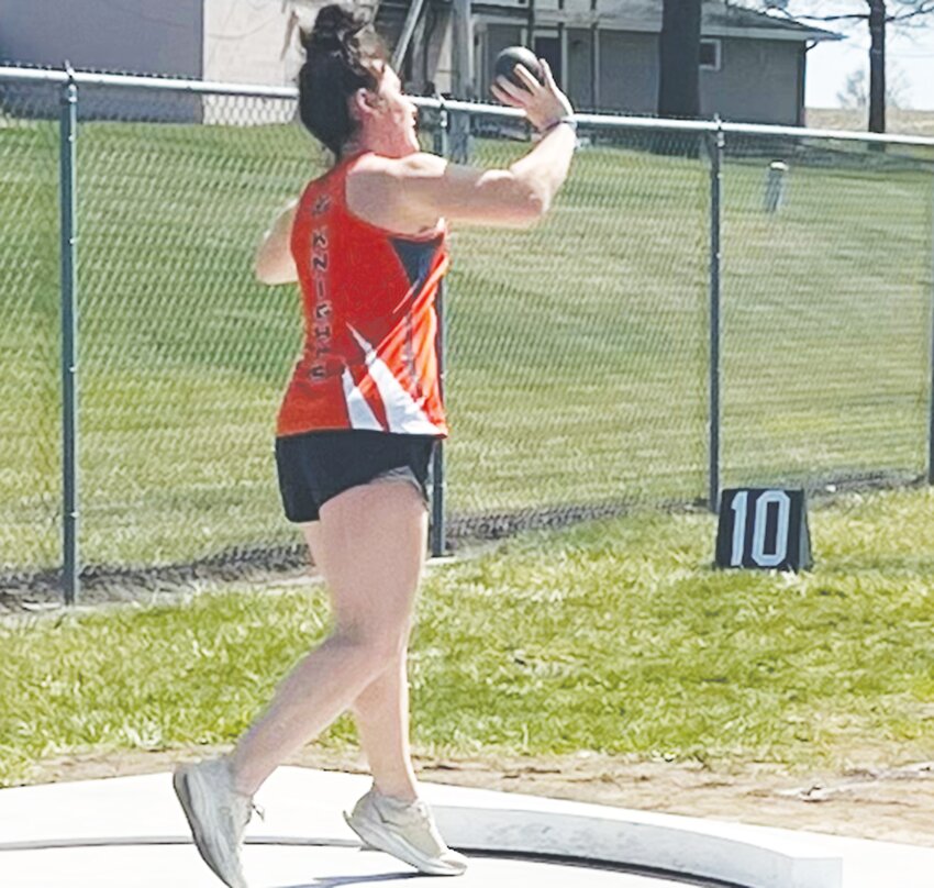 Morgan Ray tossing one of her shot put attempts. The senior won the event with a throw of 35-5.