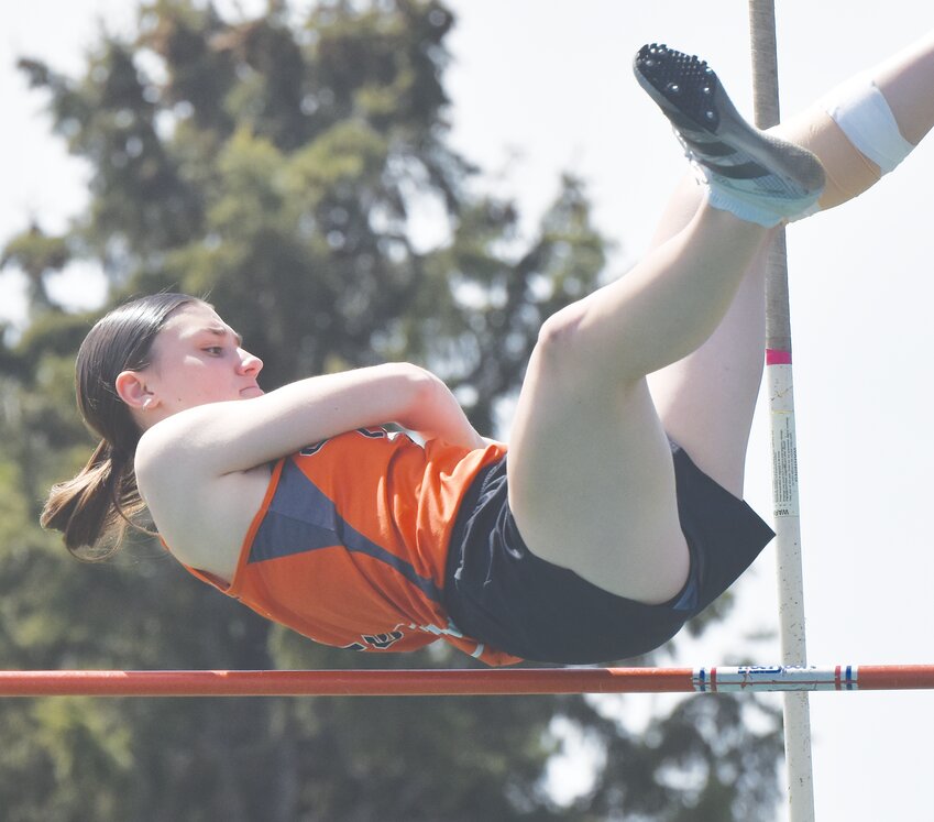 Amy Snader clears the bar in the pole vault in West Point.