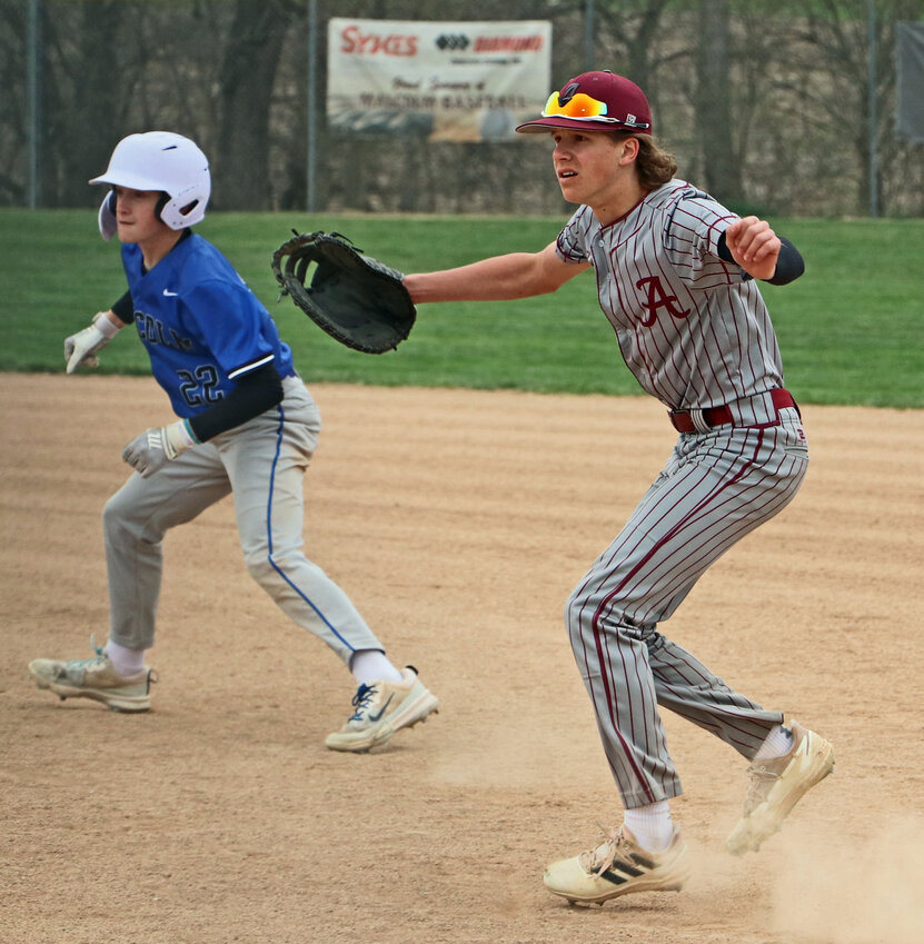 Arlington first baseman Wes Monke, right, moves into position at the pitch against the Clippers on Friday in Malcolm.
