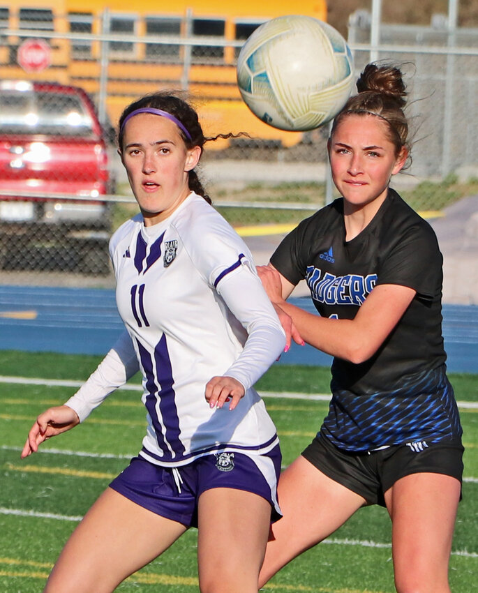 Blair junior forward Brynn Ray, left, and Badgers defender Claire Miller watch the ball as it bounds their way Thursday at Bennington High School. Ray scored the Bears' first-half goal during the EMC matchup.