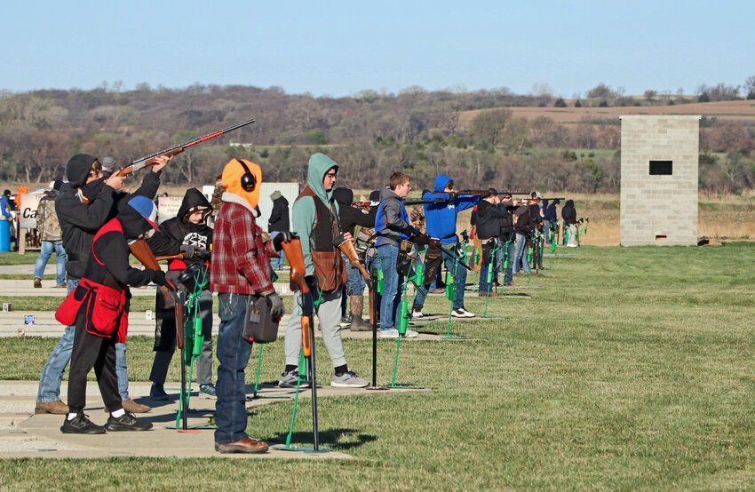 Junior marksmen and  women take their first shots Saturday during an Eastern Cornhusker Trapshooting Conference shoot at the Blair Youth Shooting Sports range.