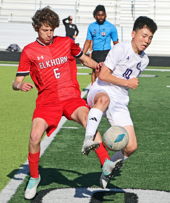 The Antlers' Brody Strohman, left, and Blair's Sakuto Yamada contend for the ball Tuesday at Elkhorn High School. The Bears and EHS were meeting for the second time this season.