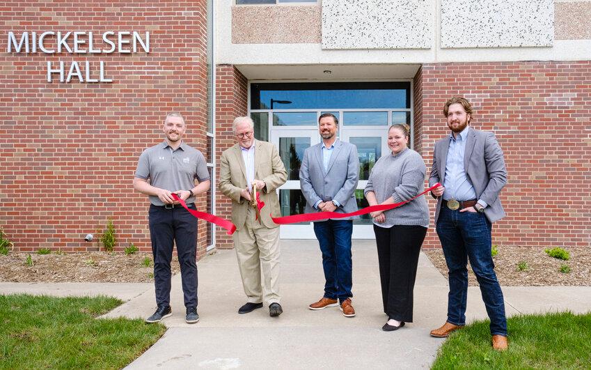 A ribbon cutting was held Tuesday morning to welcome the opening of the Dana Village apartments. Pictured from left: Ryan Dugdale of RVR Bank, Ed Shada of Angel Share, Ryan Durant of RMDX, Abby Johnson of Lutheran Family Services and Will Major of RMDX.