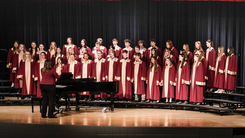 The Arlington Mixed Choir performs in the District Music Competition at Elkhorn High School Friday.