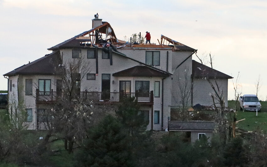 A view from County Road 38 shows a Washington County home without a roof Friday evening.