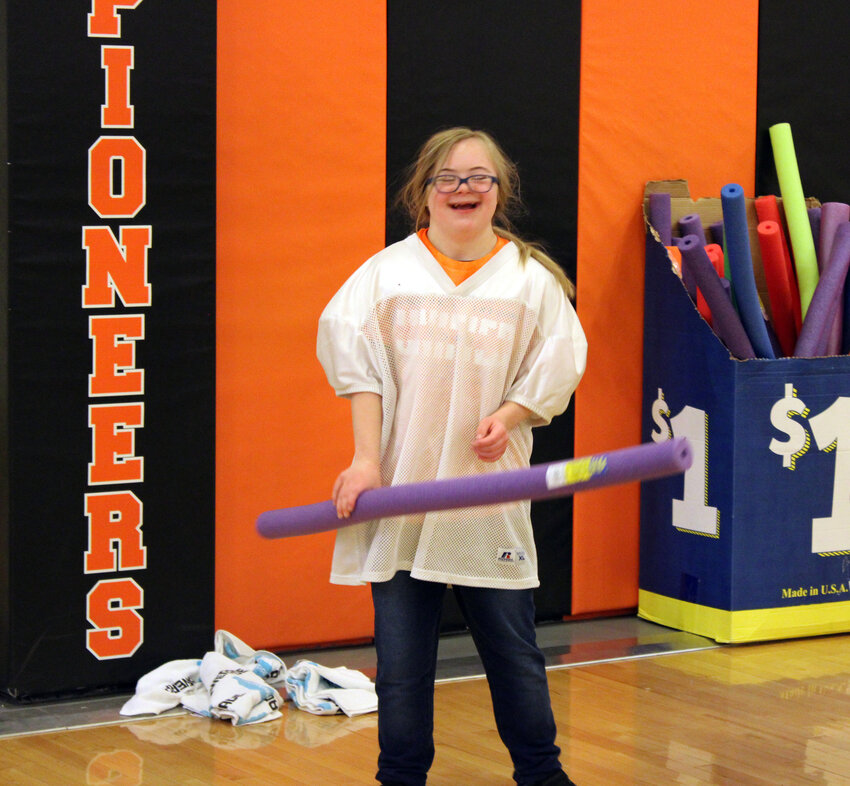 Allie Jabens of Fort Calhoun excitedly plays a round of pool noodle hockey Thursday during the Fun at the Fort event at Fort Calhoun High School. The event was held to bring unified students from Fort Calhoun, Arlington, Bennington and DC West together for a day of play.