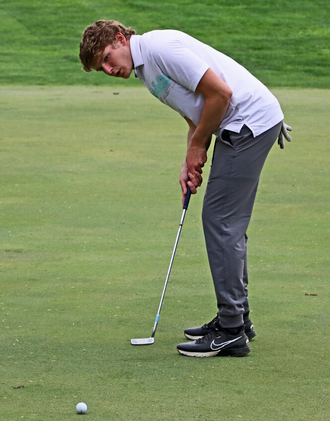 Fort Calhoun senior Owen Miller putts Tuesday at Elkhorn Valley Golf Club. The Pioneer shot his team's low score during the Logan View Invite.