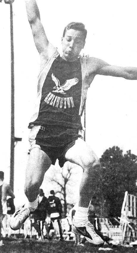 The Eagles' Thad Kloster flies through the air on a triple jump attempt during the 1996 Arlington Invitational.