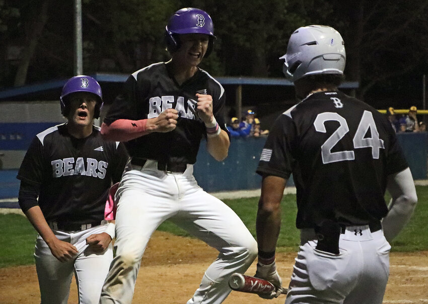 Blair baseball players Lucas Matejka, from left, Nate Wachter and J'Shawn Unger celebrate a pair of second inning runs Thursday during B-6 District Tournament play at Bennington. The Bears faced seward during the first round.